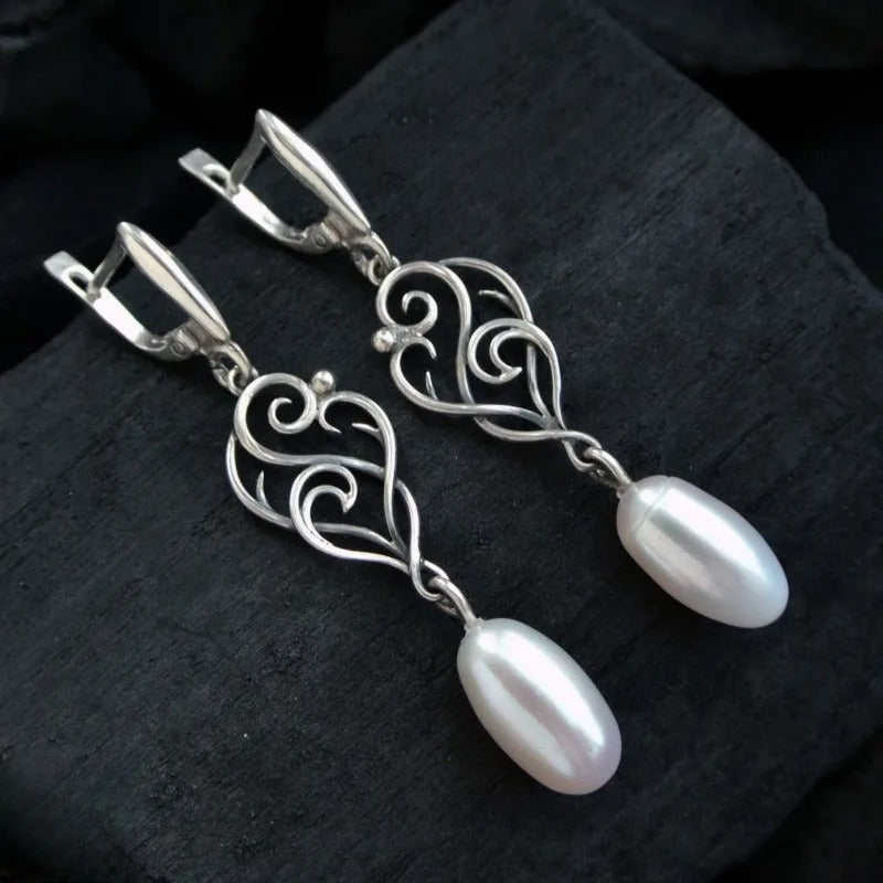 Boucles d'oreilles pendantes élégantes avec perles plaquées en argent 925