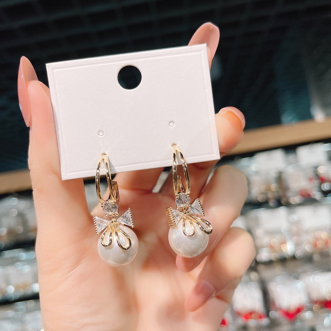 Boucles d'oreilles double nœud avec perles