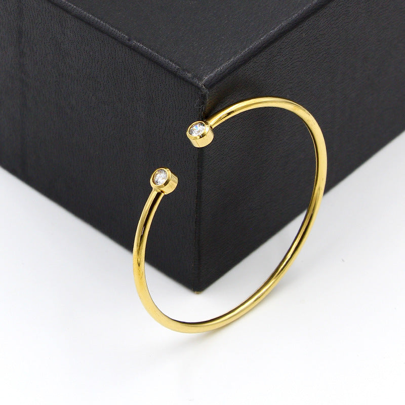 Bracelet ouvert doré à cristaux jumeaux