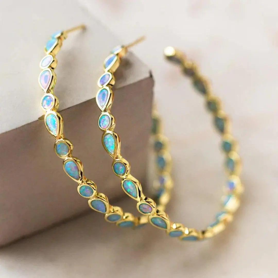 Boucles d'oreilles vintage en or avec opale bleue