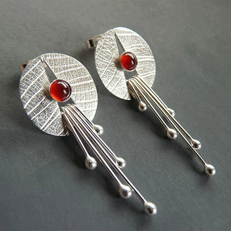 Boucles d'oreilles avec pendentif en pierre creuse rouge