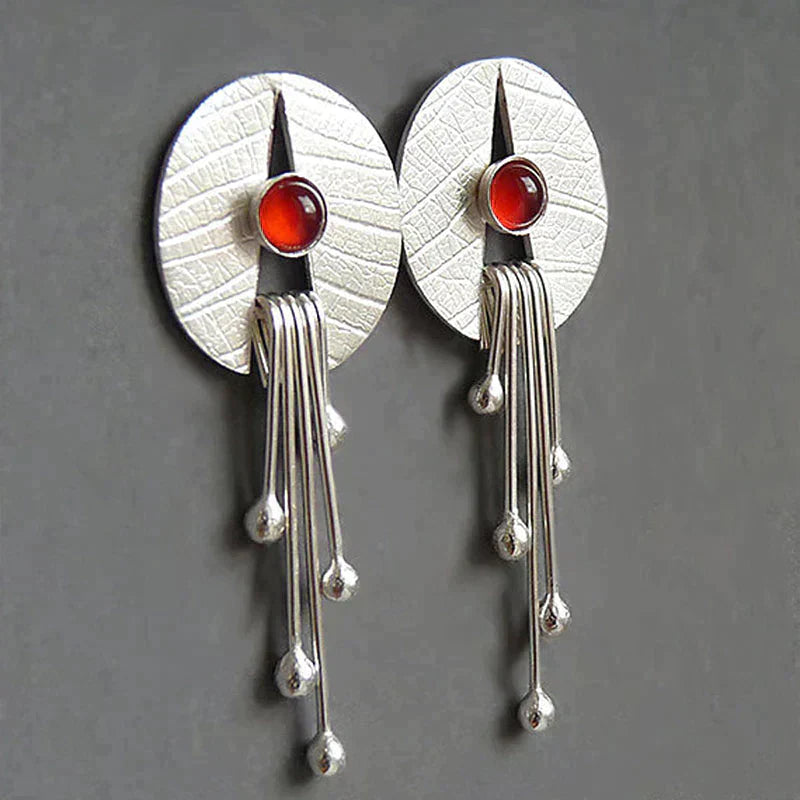 Boucles d'oreilles avec pendentif en pierre creuse rouge