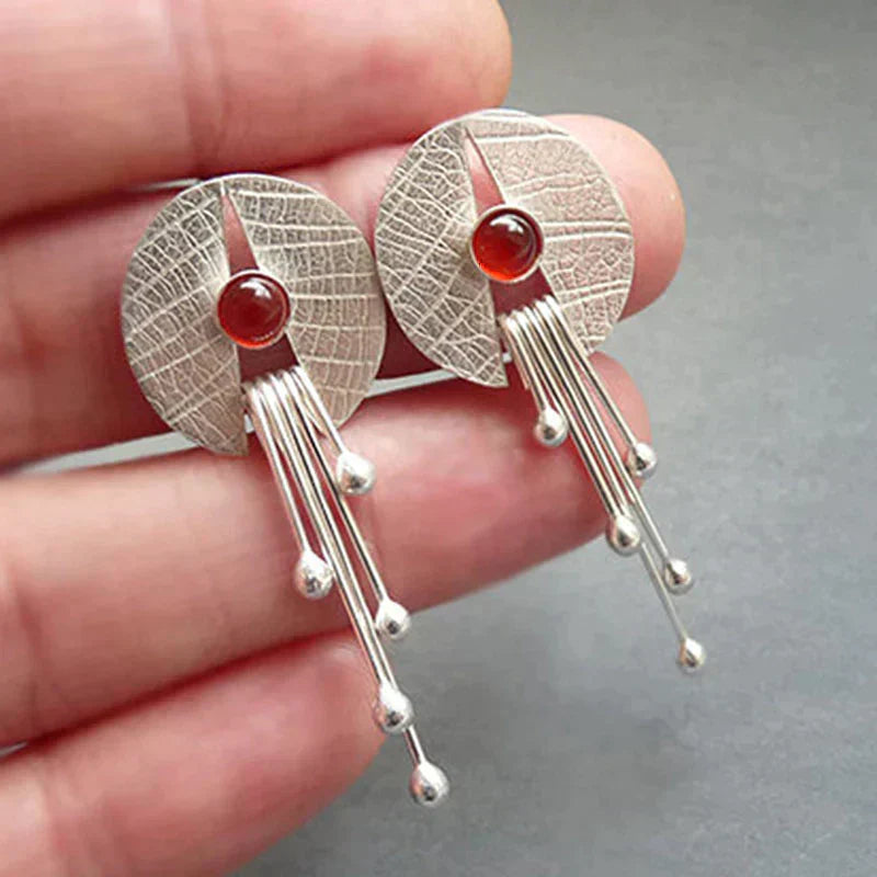 Boucles d'oreilles avec pendentif en pierre creuse rouge
