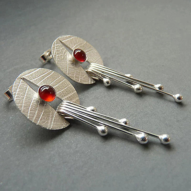 Boucles d'oreilles avec pendentif en pierre creuse rouge