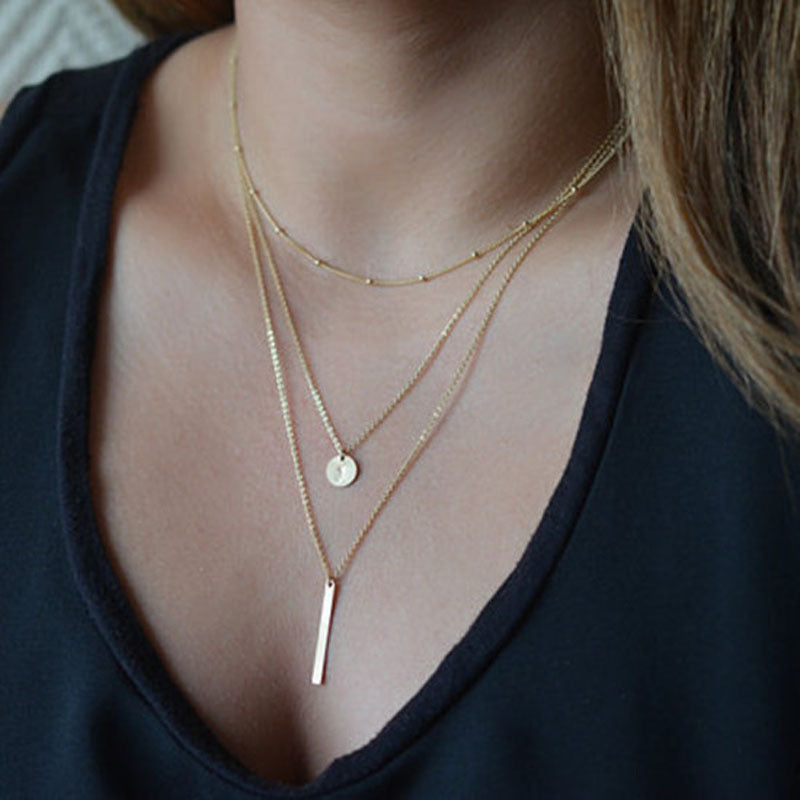 Collier vintage chaînes superposées avec pendentif géométrique