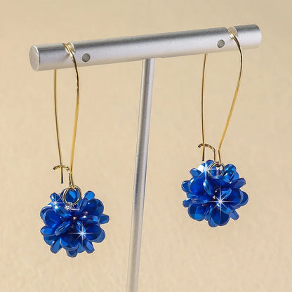 Boucles d'oreilles longues fleur de perle