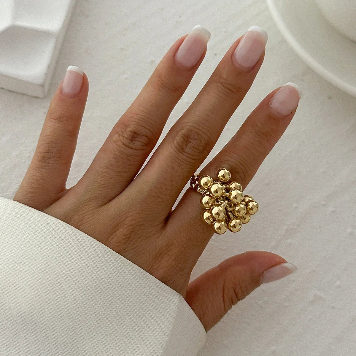 Bague ajustable à sphères dorée