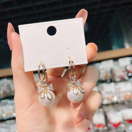Boucles d'oreilles double nœud avec perles