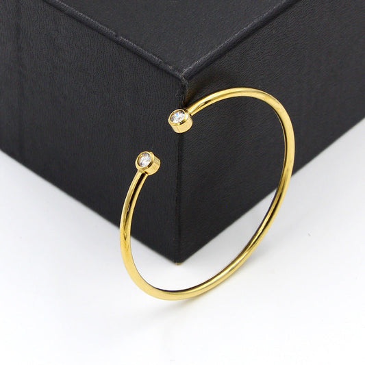 Bracelet ouvert doré à cristaux jumeaux