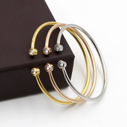 Bracelet ouvert doré à cristaux jumeaux
