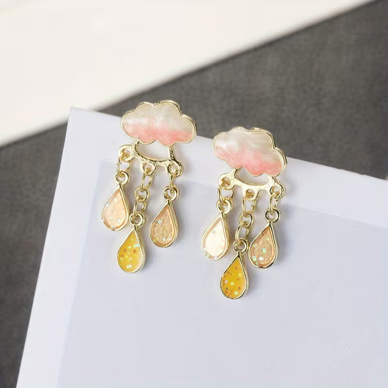 Boucles d'oreilles pendantes élégantes nuage avec pompons