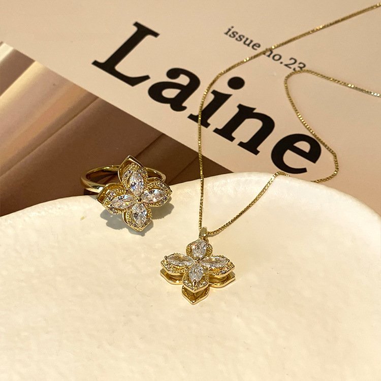 Set bague et collier tournants trèfle à quatre feuilles avec zircones