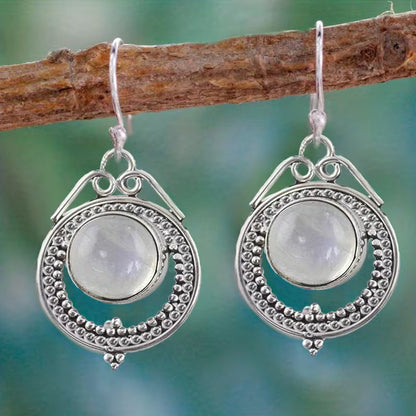 Boucles d'oreilles pendantes élégantes en pierre de lune