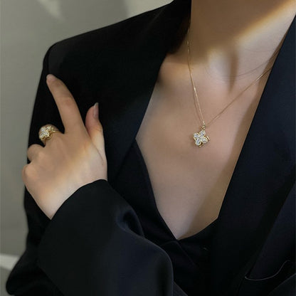 Set bague et collier tournants trèfle à quatre feuilles avec zircones