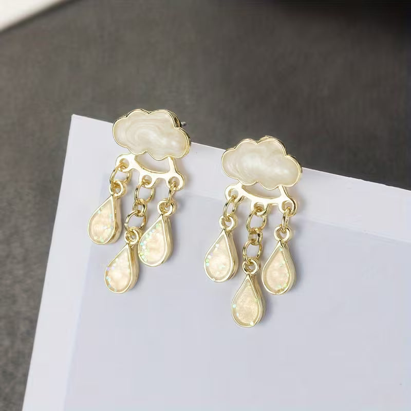 Boucles d'oreilles pendantes élégantes nuage avec pompons