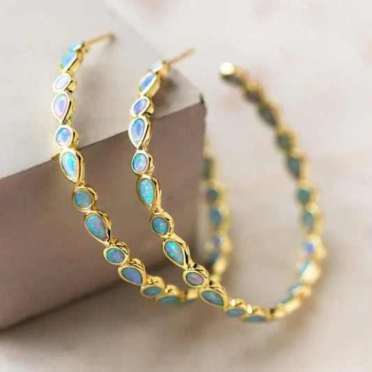 Boucles d'oreilles vintage en or avec opale bleue