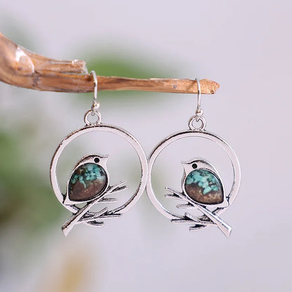 Boucles d'oreilles Oiseau sur Branche Vintage – Symbole de Liberté et de Sérénité