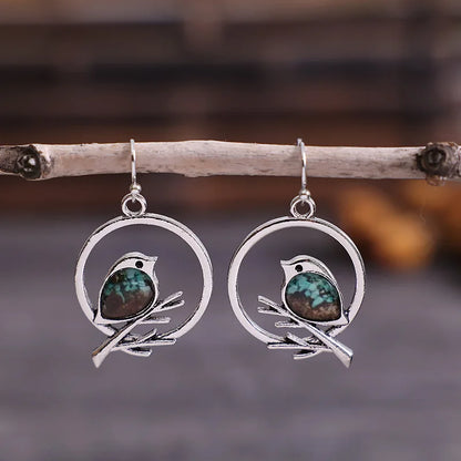 Boucles d'oreilles Oiseau sur Branche Vintage – Symbole de Liberté et de Sérénité