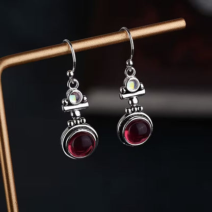 Boucles d'oreilles pendantes élégantes en pierre de lune