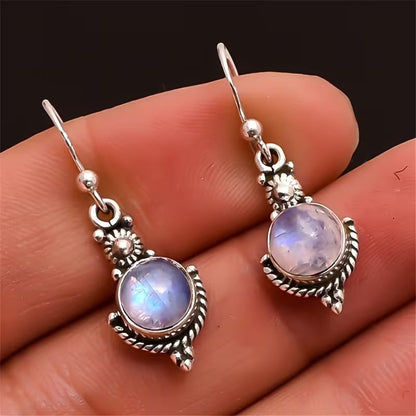 Boucles d'oreilles pendantes élégantes en pierre de lune