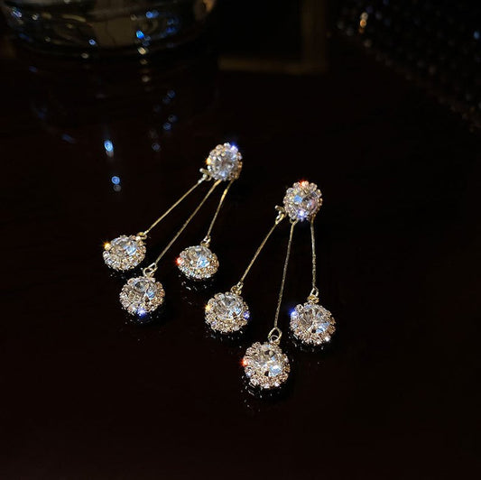 Boucles d'oreilles plaquées or Triade de zircones