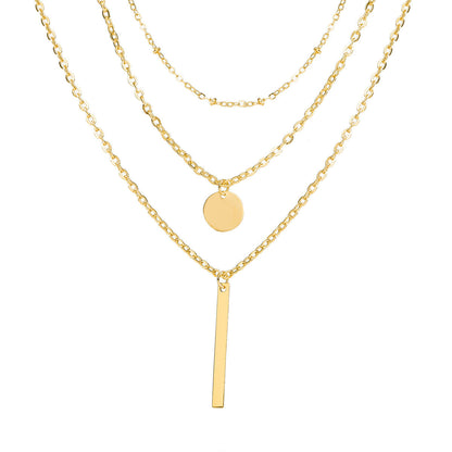 Collier vintage chaînes superposées avec pendentif géométrique