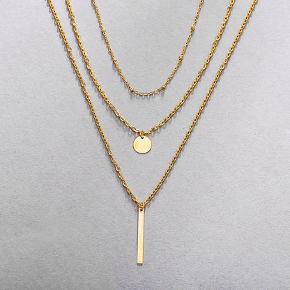 Collier vintage chaînes superposées avec pendentif géométrique
